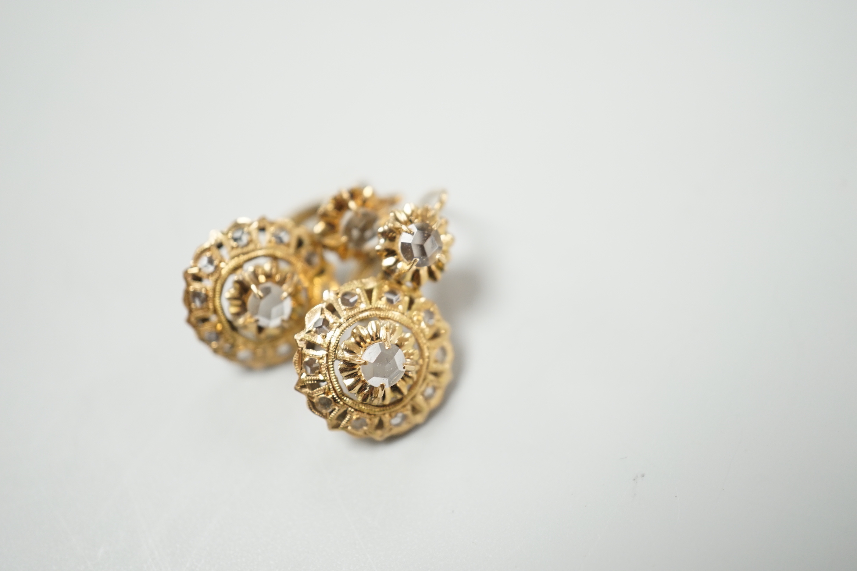 A pair of yellow metal and simulated rose cut diamond cluster set drop earrings, overall 21mm, gross weight 3 grams.